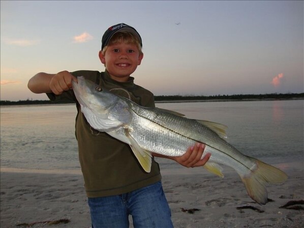 Nephew with Snook he landed right in front of the Condo