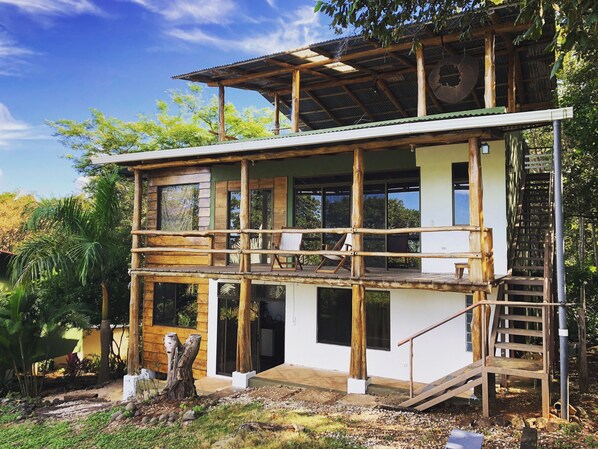 Exterior of house facing the sunset/ocean view
