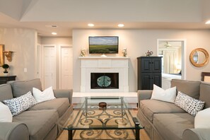 Beautifully staged living room designed for gathering.