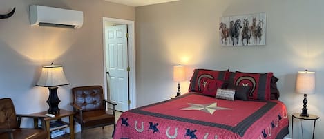 Studio with queen sized bed and sitting area