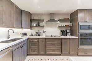 Reno'd kitchen complete with microwave, wall oven, cooktop and coffee station.