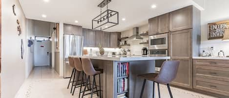 Stunning renovated kitchen with family gathering island.