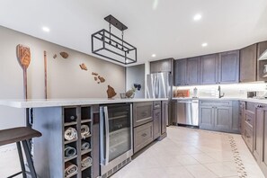 Reno'd kitchen featuring beverage fridge 