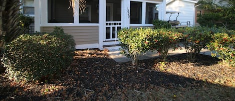 Welcoming front entry with screened in porch