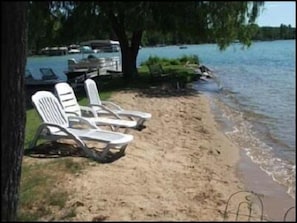 Relax and enjoy the beautiful sand on Elk Lake.