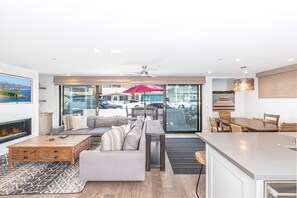 Spacious living and dining areas open up via disappearing sliders to the front patio of this high end, downstairs 3bd/3 ba ocean view unit.
                
