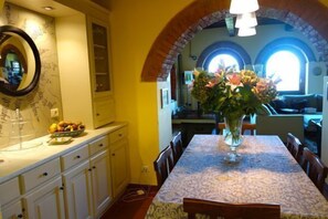 View from kitchen through dining room into living room.