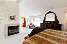 Spacious Master Bedroom Suite with Cal-King Bed, Fireplace, Dresser set, Chair