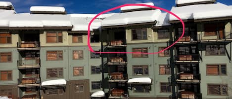 Exterior of building seen from ski run.  Our unit circled in red.