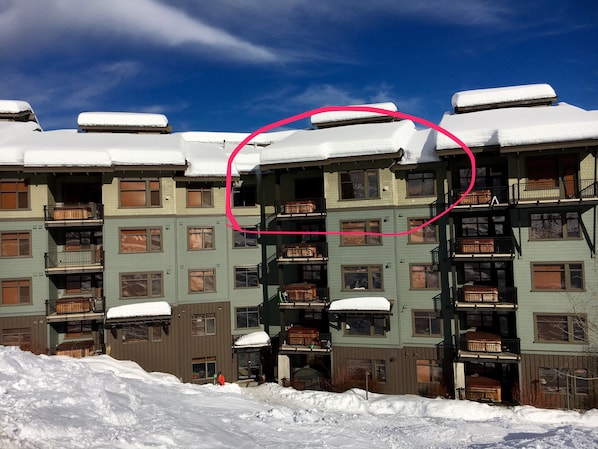 Exterior of building seen from ski run.  Our unit circled in red.
