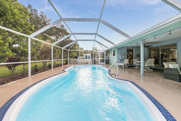 Enjoy the screened-in, heated swimming pool (heated seasonally).  