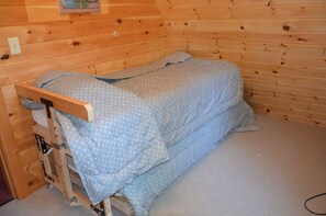 day bed with trundle located in the second bedroom.