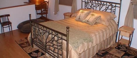 The entire upstairs is one large room with a queen bed