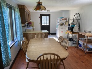 Dining area and kitchen - table has 6 seats
