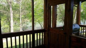Screened back porch looking toward grill area. 