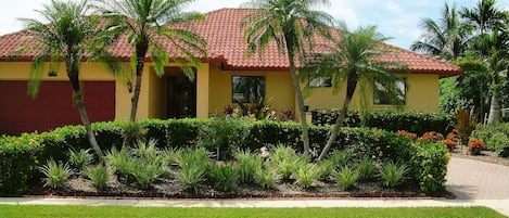 Front of Home with lush landscaping