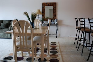 Dining table with additional seating at the breakfast bar