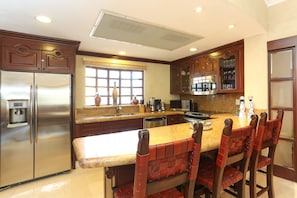 The kitchen and breakfast bar.