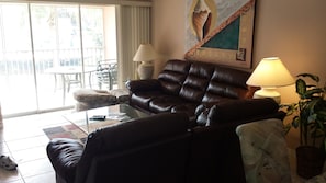 Living room with new leather recliner sofas