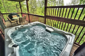 Soak away all your worries in the hot tub on the main level back deck. 