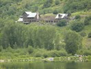 Marble Lodge on Beaver Lake Retreat campus viewed from Beaver Lake in Marble.