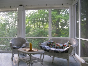 The back screened porch is great for entertaining and relaxing.