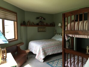 Second bedroom with a full bed, twin bunks and a hidden trundle