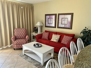 Living room with sleeper sofa and with oceanfront balcony  