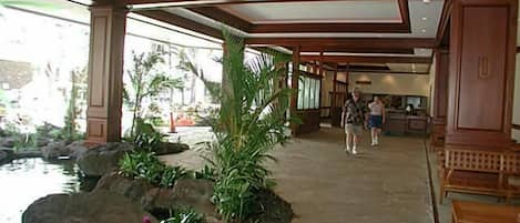 Lobby area is open and beautiul with koi ponds.