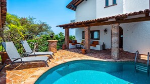 Private pool and outdoor living area with view to ocean