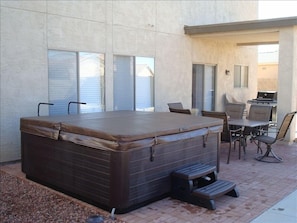 Patio with grill, patio set, & hot tub