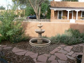 Relax on the portal and listen to the falling water in the fountain.