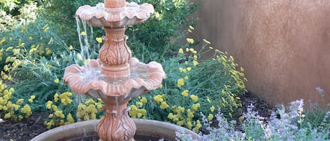 The trickling water in the fountain is so relaxing while out in the lush yard.