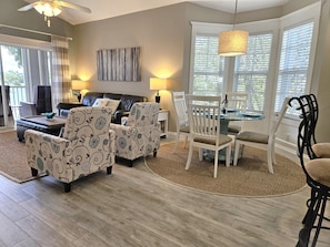 Family room and dining area. Beautiful sand color tiles throughout the condo