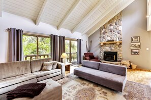 Comfy couches and wood burning fireplace in the great room