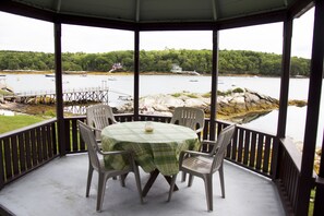 Gazebo portion of front porch and view of inner bay with public wharf and float 