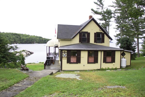 House as seen from the back yard with steps leading from the street