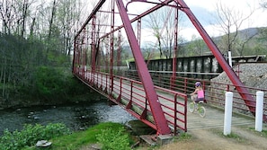 walk to the red bridge built in 1910 and overlooking Spring Creek