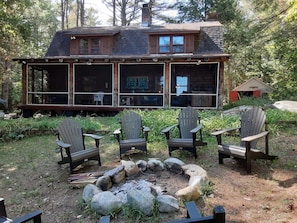 Front porch and fire pit overlooking the lake
