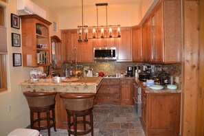 Full Kitchen with gas stove top, mico wave, ice maker, Ref, freezer, Expresso-co