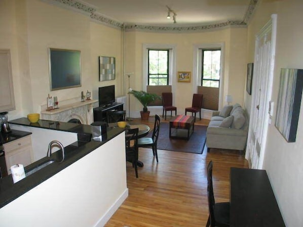 Living dining area. from the windows views of Tremont St and the Boston skyline