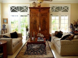 COMFORTABLE elegant family rm. boasts gorgeous rare antiques & gleaming floors. 