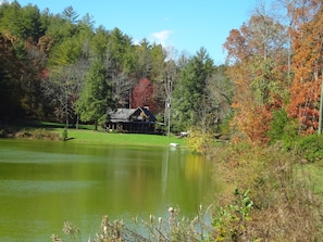 The autumn view from across the pond shows the beauty of lakeside solitude.