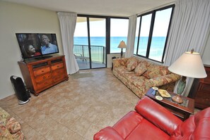 Relax in the recliner  or lounge on the  sofa watching TV with an ocean view.