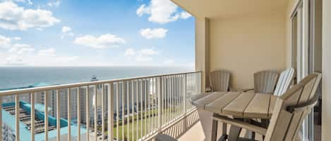 Spacious balcony features high quality furniture and beautiful Gulf views