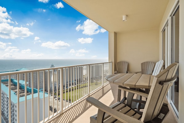 Spacious balcony features high quality furniture and beautiful Gulf views