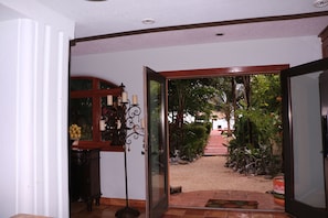 Garden view from Dining area. Your bridge to the Caribbean Sea & palapa dock.