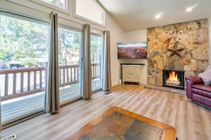 family room w/balcony with sunset views