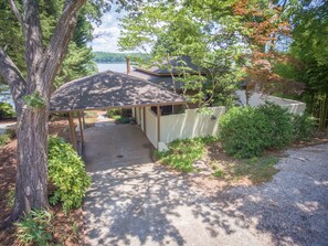 street side of house with carport, 2 extra parking spaces and courtyard