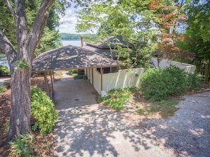 street side of house with carport, 2 extra parking spaces and courtyard